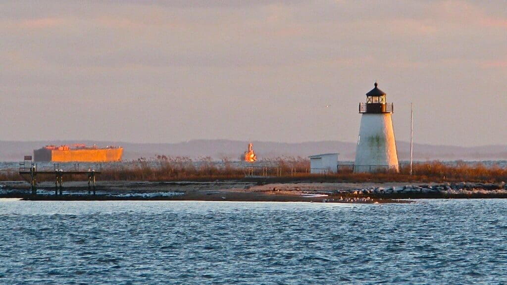 Coastal lighthouse at sunset