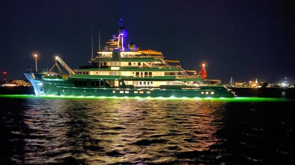 Luxury yacht illuminated at night