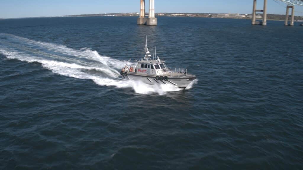 Patrol boat speeds through water